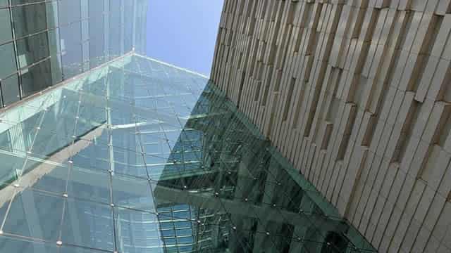 GHLD vs. MCO: Which Stock Should Value Investors Buy Now?