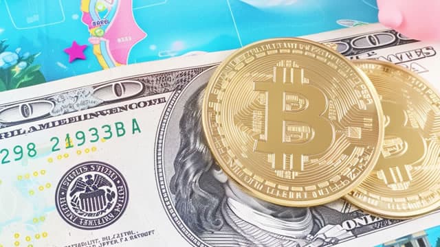 Cryptocurrencies: Bitcoin Hits Record High as Ether Nears Its Own